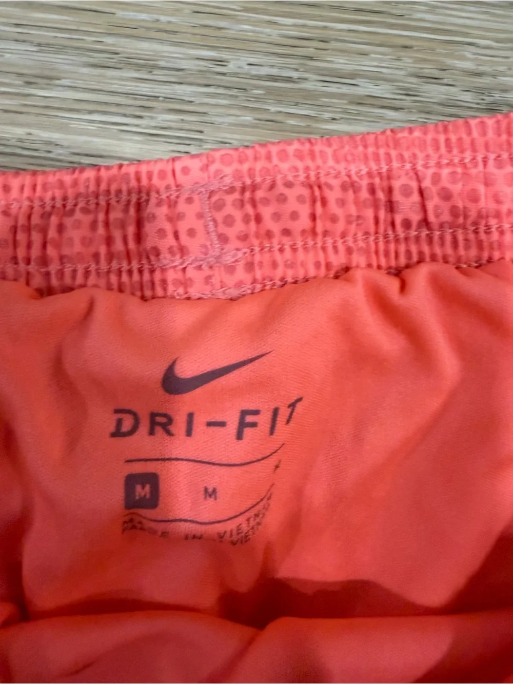 Nike Women’s Neon Coral Mesh Athletic Shorts with Blue Swoosh